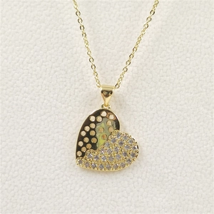 Golden heart pendant necklace with white zircons and sun pattern on fine gold chain