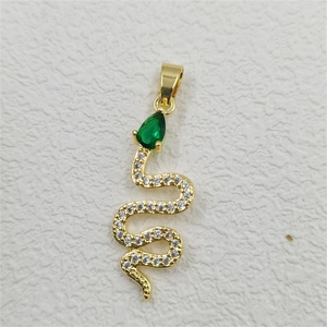 Detail of a gold snake pendant with pear-shaped green gemstone and pavé-set stones