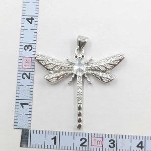 Macro shot of dragonfly pendant wings with micro-pave cubic zirconia and dimensions
