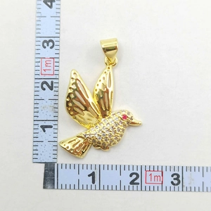 Detailed size measurement of a gold hummingbird pendant with sparkling cubic zirconia