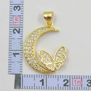 Detailed size measurement of gold bow and moon pendant with sparkling zircon stones