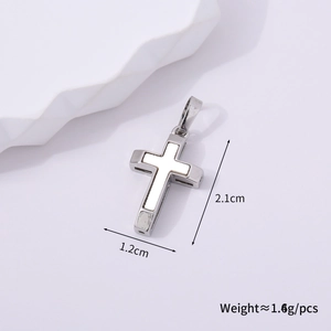 Detailed view of a silver cross pendant with white inlay showing 2.1cm by 1.2cm size