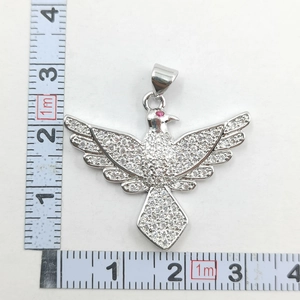 Detailed measurement of bird pendant with sparkling white zircons and pink gemstone eye