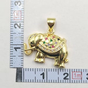 Macro shot of gold elephant pendant measuring 25mm x 20mm with colorful zircons