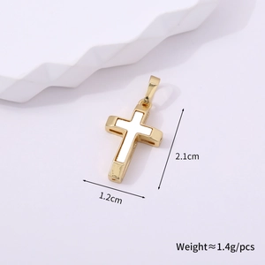 Detail view of gold cross pendant with white inlay and dimensions of 2.1cm by 1.2cm