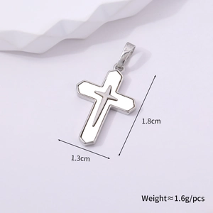 Detail showing dimensions of 1.3cm by 1.8cm silver cross pendant with white center