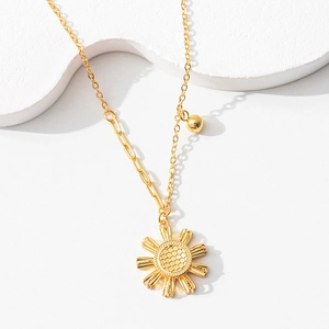 Retro sunflower heart necklace with golden CNC hollow design on minimalist white stone