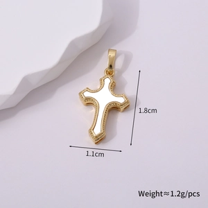 Macro detail of a 1.8x1.1cm gold-plated cross pendant with white enamel inlay