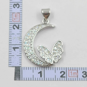 Detailed measurement of silver bow moon pendant with zircons showing 2.5cm height