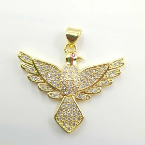 Elegant gold-plated bird pendant with sparkling crystals and a red ruby-like eye detail