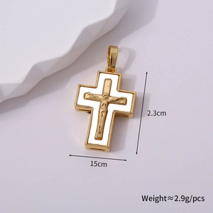 Detailed macro view of a vintage gold crucifix pendant with white enamel inlay accents