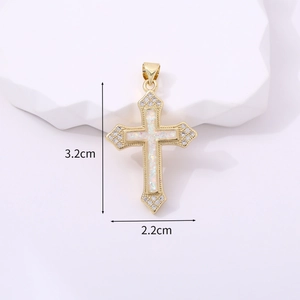 Macro view of gold cross pendant with opal center and zircon stones measuring 3.2cm by 2.2cm