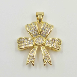 Elegant gold-plated bow necklace pendant featuring sparkling pave-set cubic zirconia stones
