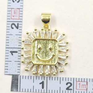 Detailed view of golden smiling sunflower pendant with zircon stones showing 25mm dimensions