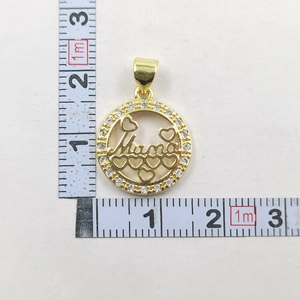 Detail of a 2.5cm gold Mama pendant with heart cutouts and sparkling zircon stones