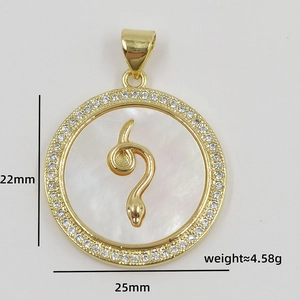 Detailed view of snake-embossed shell pendant with zircon border and 22mm size specs
