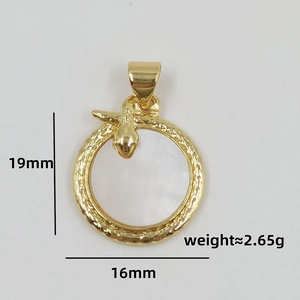 Macro detail of snake pendant with golden scales and white shell inlay, size 19x16mm