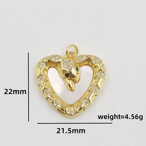 Gold snake pendant in hollow heart with green gemstone eyes and white cubic zirconia