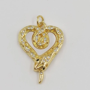 Golden snake-shaped heart pendant necklace featuring white crystals on a white background