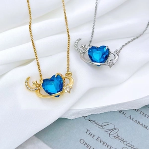 Star and moon planet heart pendant necklace in gold and silver finish with blue crystal