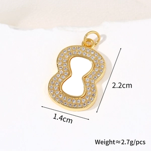 Macro shot of gold-plated shell gourd pendant with cubic zirconia and size dimensions