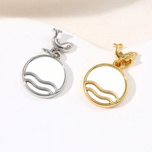 Marine theme circular shell pendants with wave details and small dolphin charms