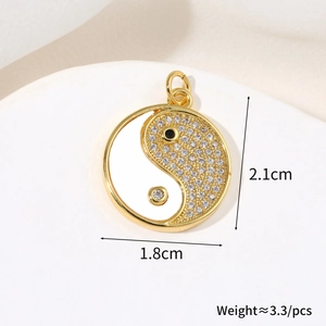 Macro view of gold Tai Chi pendant showing 1.8cm by 2.1cm dimensions and weight detail
