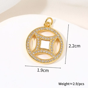 Macro shot of gold-plated coin pendant with cross star cutouts and pavé zircons