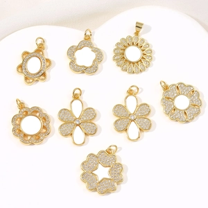 Collection of gold flower pendants with white shell petals and sparkling zircon accents