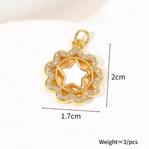 Macro shot of a 2cm 18k gold plated sunburst pendant with zircon micro-pave and star center