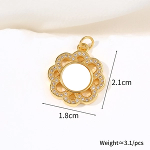 Detail view of flower pendant with shell petals and size specs 2.1cm by 1.8cm