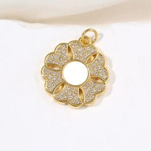 Golden flower pendant necklace featuring white shell petals and sparkling rhinestone accents