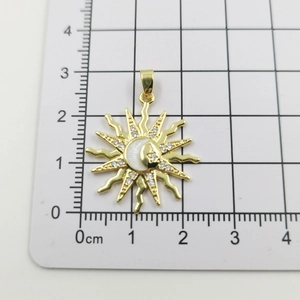 Size measurement of golden sun pendant with moon shell inlay and zircon accents