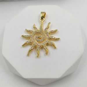 Golden sunburst sunflower pendant with sparkling crystals on a geometric display