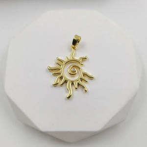 Polished gold sun pendant necklace with spiral design and sparkling central zircon stone