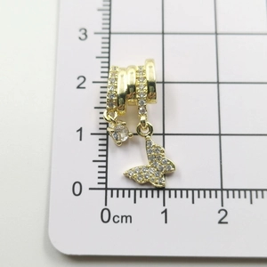 Detailed size measurement of a gold butterfly pendant with sparkling white rhinestones