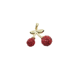 Sparkling cherry pendant with red crystals and gold-plated leaf on white background