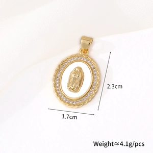 Macro shot of gold oval Virgin Mary pendant with white shell inlay and zircon details