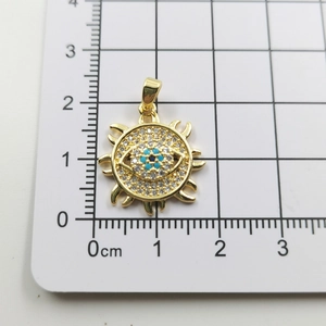 Detailed size measurement of the gold sun eye pendant showing a 1.8cm diameter
