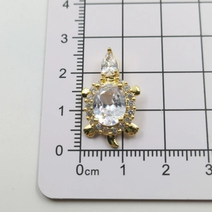 Detailed measurement of gold turtle pendant with crystal shell and paved stones