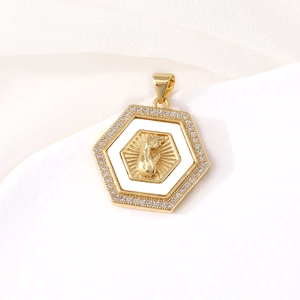 Gold hexagon pendant with praying hands and white enamel inlay on silk background