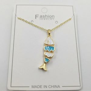 Golden fish bone necklace with blue enamel and sparkling zircon on white display card