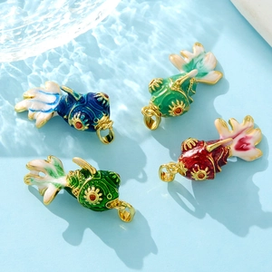 Golden Y2K koi fish pendants with colorful enamel drips and shimmering scale patterns