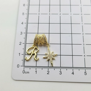 Gold letter R necklace with star pendant and zircon inlays on measurement scale