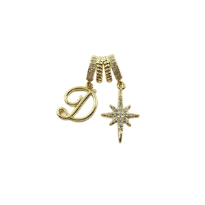 Gold letter D and sparkling star pendant with zircon accents on a white background