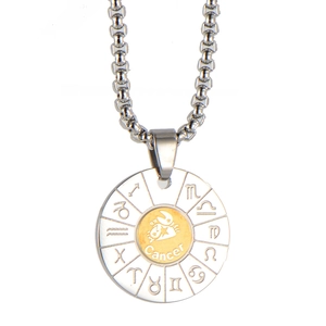 Detail view of round Cancer zodiac pendant necklace with engraved astrological symbols