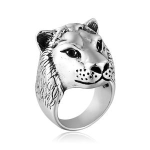 Close-up of vintage titanium steel ring featuring a detailed leopard head carving