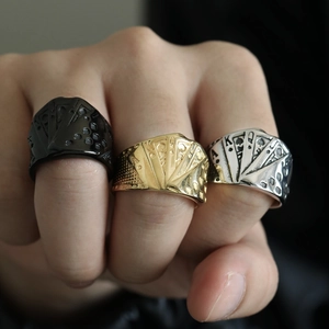Three-piece set of men's poker rings in gold, silver, and black stainless steel finishes