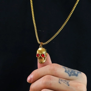 Gold skull pendant necklace with red crystal eyes and box chain in punk style