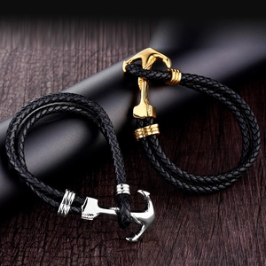 Modaiolo bracciale intrecciato ad ancora con ganci oro e argento su cinturini in pelle nera
